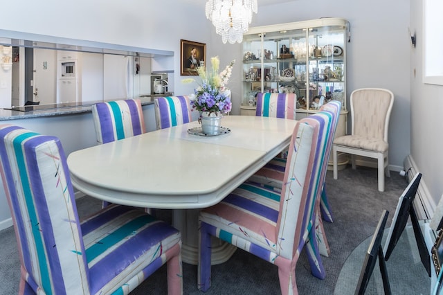 10411 Cedar Lake Rd Unit 301, Minnetonka, MN 55305 - carpeted dining room with baseboards and an inviting chandelier