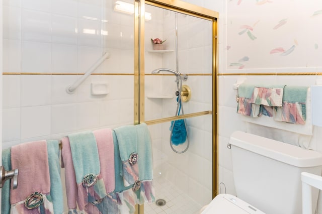 10411 Cedar Lake Rd Unit 301, Minnetonka, MN 55305 - bathroom with tile walls, toilet, and a stall shower