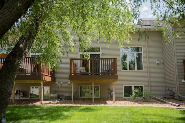 3220 40th Ave S Unit D, Fargo, ND 58104 - rear view of property with a deck, central AC, and a lawn