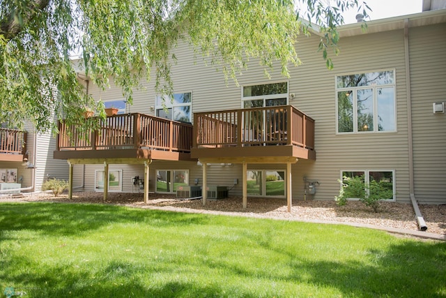 3220 40th Ave S Unit D, Fargo, ND 58104 - back of property featuring a yard, a deck, and central air condition unit