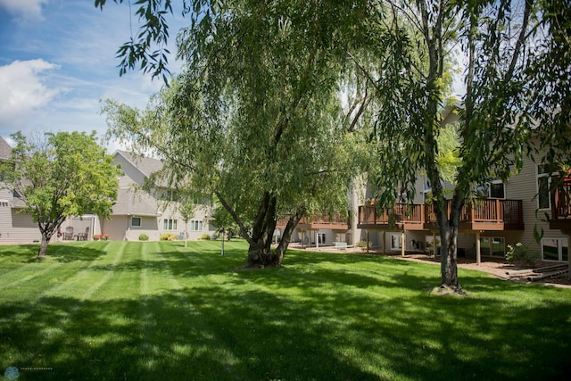 3220 40th Ave S Unit D, Fargo, ND 58104 - view of yard with a wooden deck and a residential view