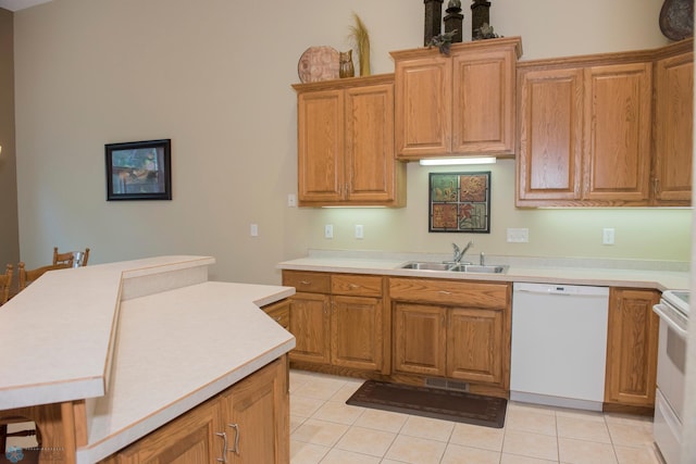 3220 40th Ave S Unit D, Fargo, ND 58104 - kitchen with a sink, light countertops, white appliances, and light tile patterned flooring