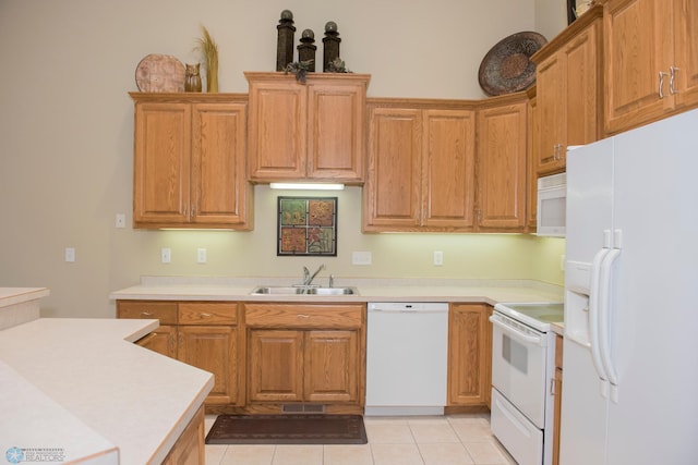 3220 40th Ave S Unit D, Fargo, ND 58104 - kitchen featuring light tile patterned floors, white appliances, visible vents, light countertops, and a sink