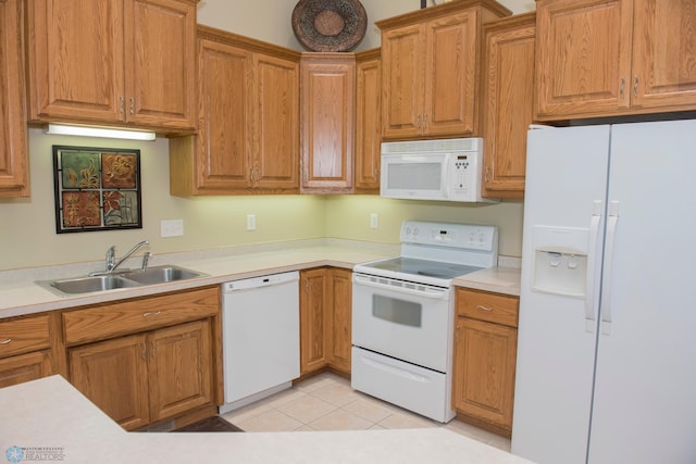 3220 40th Ave S Unit D, Fargo, ND 58104 - kitchen with light countertops, a sink, and white appliances