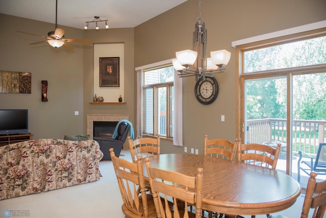 3220 40th Ave S Unit D, Fargo, ND 58104 - dining room with a tile fireplace and ceiling fan with notable chandelier