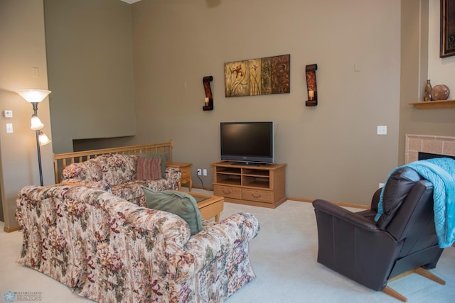 3220 40th Ave S Unit D, Fargo, ND 58104 - living area featuring carpet flooring, baseboards, and a fireplace