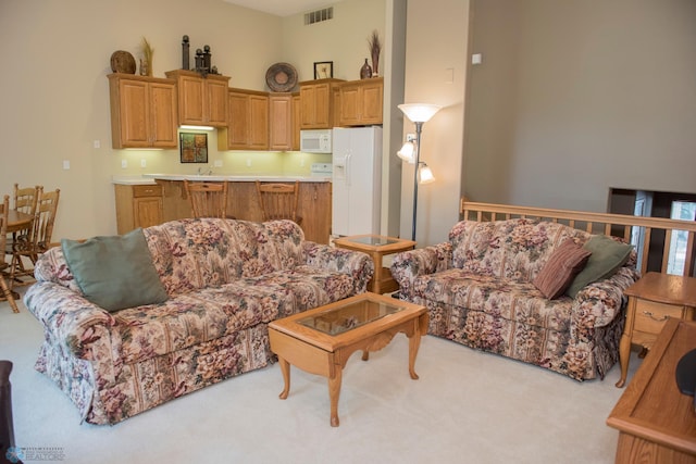 3220 40th Ave S Unit D, Fargo, ND 58104 - living room with visible vents and light colored carpet