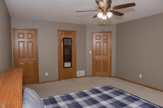 3220 40th Ave S Unit D, Fargo, ND 58104 - unfurnished bedroom with a textured ceiling, carpet, and visible vents