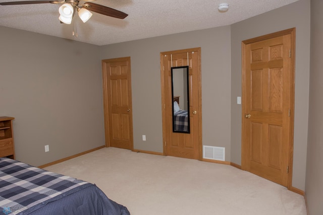 3220 40th Ave S Unit D, Fargo, ND 58104 - bedroom featuring carpet, visible vents, a textured ceiling, and baseboards