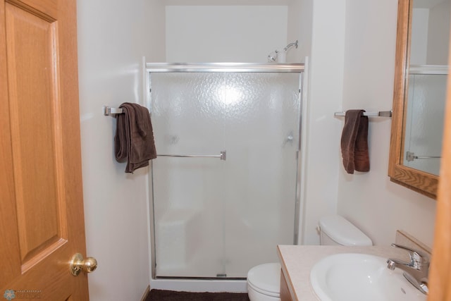 3220 40th Ave S Unit D, Fargo, ND 58104 - bathroom featuring toilet, a stall shower, and vanity