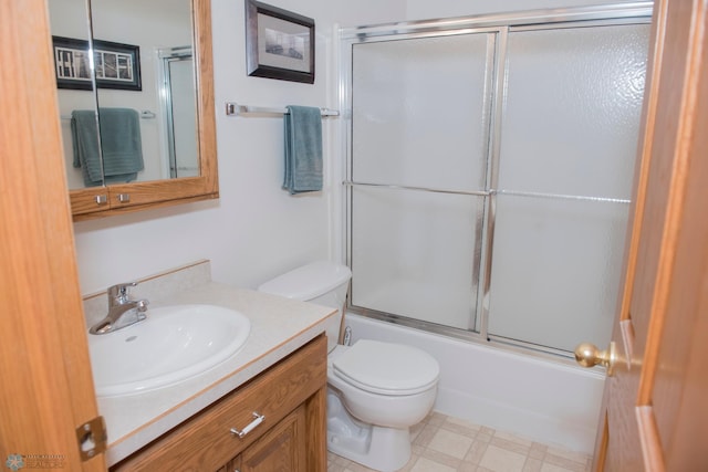 3220 40th Ave S Unit D, Fargo, ND 58104 - full bath with tile patterned floors, vanity, toilet, and bath / shower combo with glass door