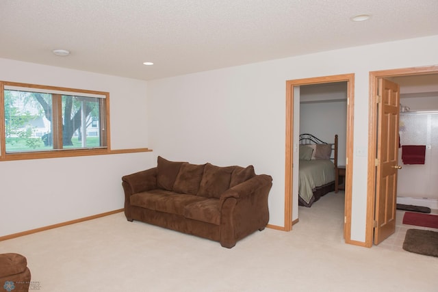 3220 40th Ave S Unit D, Fargo, ND 58104 - living area featuring light colored carpet, baseboards, and recessed lighting
