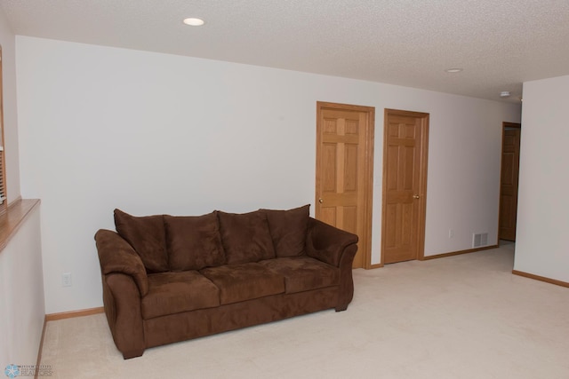 3220 40th Ave S Unit D, Fargo, ND 58104 - carpeted living room featuring recessed lighting, visible vents, baseboards, and a textured ceiling