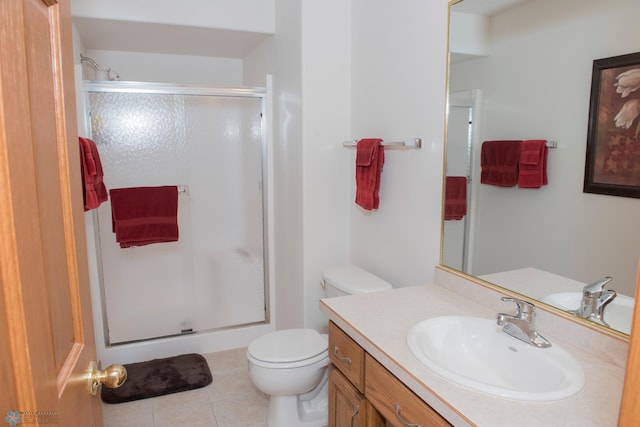 3220 40th Ave S Unit D, Fargo, ND 58104 - bathroom featuring toilet, a stall shower, vanity, and tile patterned flooring
