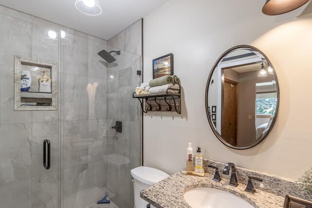 20206 Monks Ave, Mankato, MN 56001 - full bathroom with vanity, a stall shower, and toilet