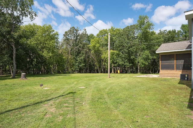 24182 184th St NW, Orrock Twp, MN 55309 - view of green lawn featuring a sunroom and cooling unit