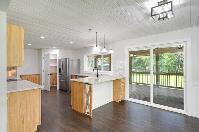 24182 184th St NW, Orrock Twp, MN 55309 - kitchen with a peninsula, stainless steel fridge, wooden ceiling, light stone countertops, and dark wood finished floors
