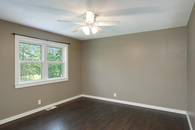 24182 184th St NW, Orrock Twp, MN 55309 - empty room featuring baseboards, dark wood-style floors, and a ceiling fan