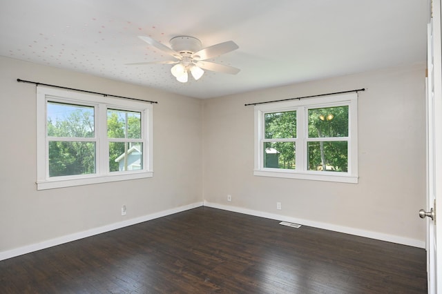 24182 184th St NW, Orrock Twp, MN 55309 - spare room featuring healthy amount of natural light, dark wood-type flooring, baseboards, and ceiling fan