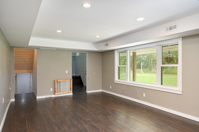 24182 184th St NW, Orrock Twp, MN 55309 - empty room with wood finished floors, recessed lighting, baseboards, and a raised ceiling