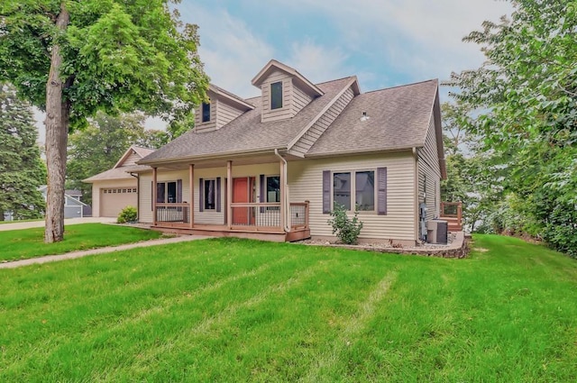 new england style home with covered porch, roof with shingles, a front yard, a garage, and central AC