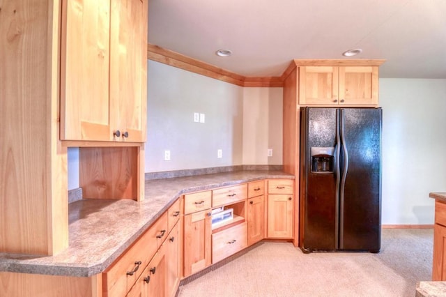 kitchen with light countertops, black refrigerator with ice dispenser, light brown cabinetry, and light carpet