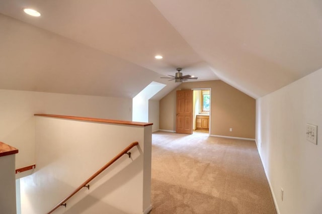 bonus room featuring baseboards, ceiling fan, light colored carpet, recessed lighting, and vaulted ceiling