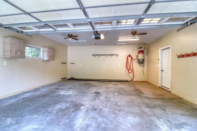 garage with baseboards and a garage door opener