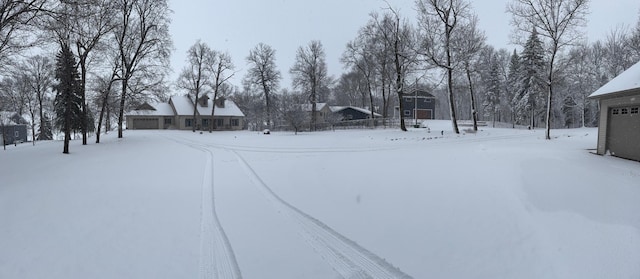 view of yard layered in snow