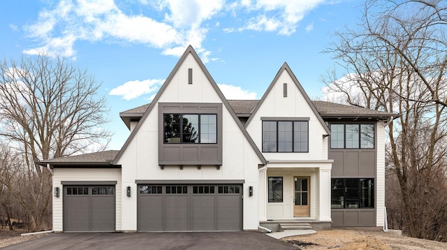 1774 Dodd Rd, Mendota Heights, MN 55118 - modern inspired farmhouse featuring a shingled roof, an attached garage, a garage, board and batten siding, and driveway