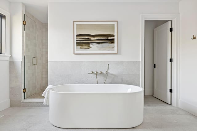 1774 Dodd Rd, Mendota Heights, MN 55118 - full bath with a shower stall, a freestanding bath, and tile walls