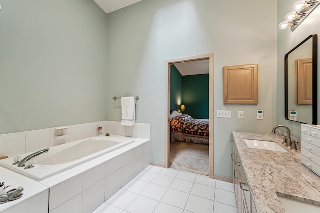bathroom featuring a bath, a high ceiling, vanity, and tile patterned flooring