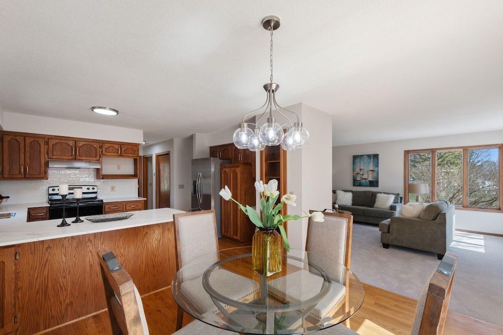 5455 Farley Ave SE, Franklin Twp, MN 55328 - dining room with a chandelier