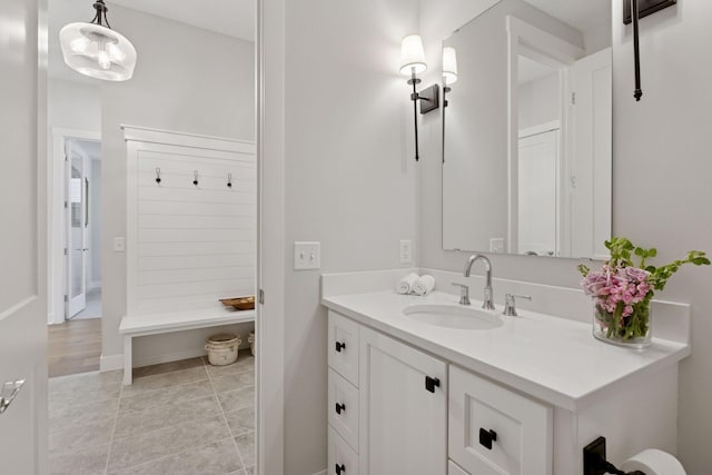 bathroom featuring tile patterned flooring and vanity