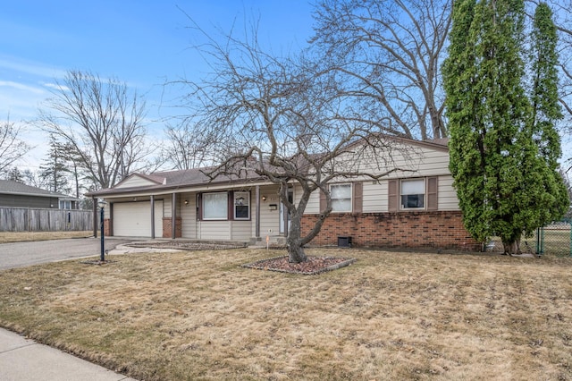 ranch-style house with a garage, aphalt driveway, brick siding, and fence
