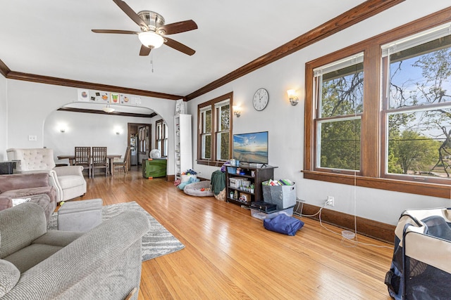 382 Fry St, Saint Paul, MN 55104 - living area featuring arched walkways, a ceiling fan, crown molding, and hardwood / wood-style floors