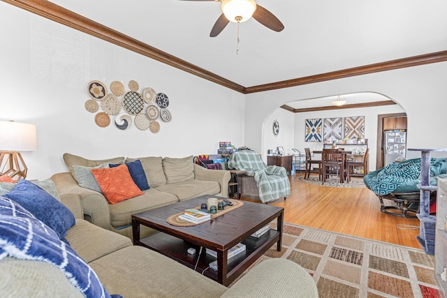 382 Fry St, Saint Paul, MN 55104 - living area featuring arched walkways, ornamental molding, wood finished floors, and ceiling fan