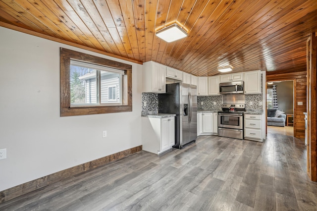 kitchen with white cabinets, appliances with stainless steel finishes, wooden ceiling, and dark wood finished floors
