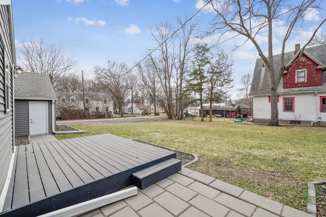 view of yard with a residential view and a deck