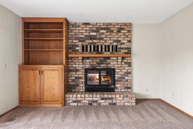 2591 Carver Ave E, Maplewood, MN 55119 - unfurnished living room featuring carpet flooring, a brick fireplace, and baseboards