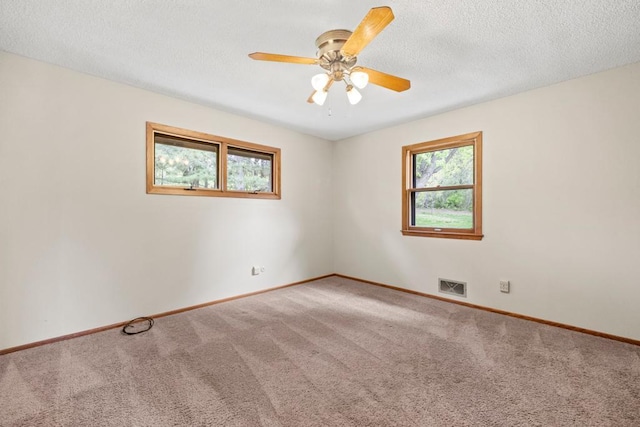 2591 Carver Ave E, Maplewood, MN 55119 - carpeted spare room featuring baseboards, ceiling fan, and a textured ceiling