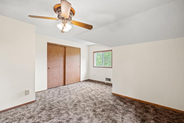 2591 Carver Ave E, Maplewood, MN 55119 - unfurnished bedroom with carpet floors, baseboards, a closet, and ceiling fan