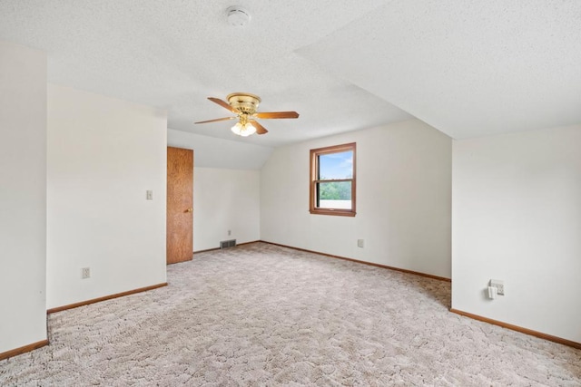 2591 Carver Ave E, Maplewood, MN 55119 - additional living space with a ceiling fan, carpet flooring, baseboards, a textured ceiling, and lofted ceiling