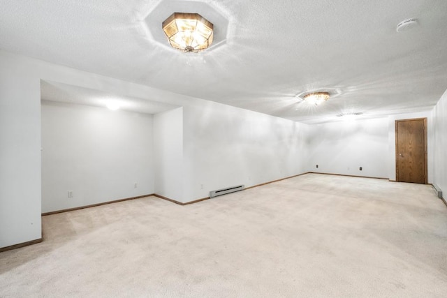 2591 Carver Ave E, Maplewood, MN 55119 - finished basement featuring a baseboard heating unit, a textured ceiling, carpet floors, and baseboards