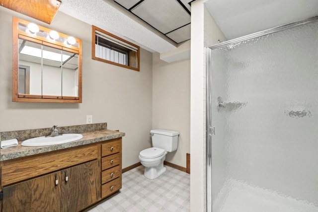 2591 Carver Ave E, Maplewood, MN 55119 - bathroom with tile patterned floors, a shower stall, toilet, and vanity