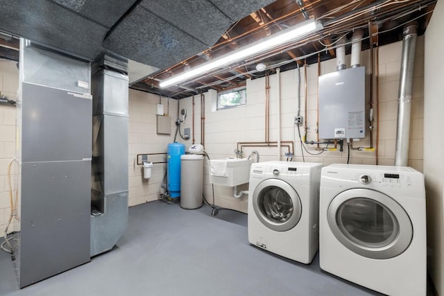 2591 Carver Ave E, Maplewood, MN 55119 - laundry area featuring washer and dryer, water heater, concrete block wall, and heating unit