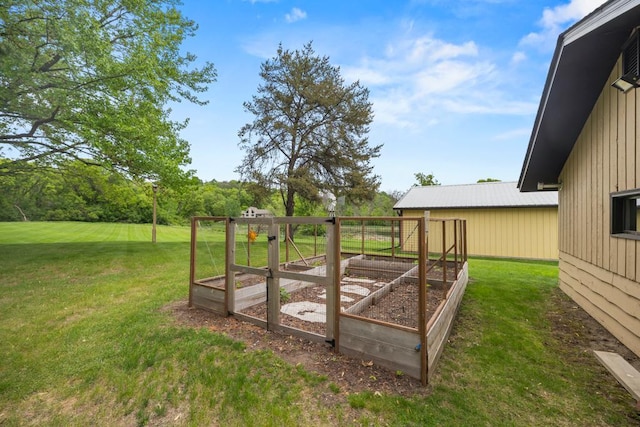 2591 Carver Ave E, Maplewood, MN 55119 - view of green lawn featuring a vegetable garden