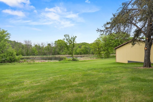 2591 Carver Ave E, Maplewood, MN 55119 - view of green lawn featuring a water view and a wooded view
