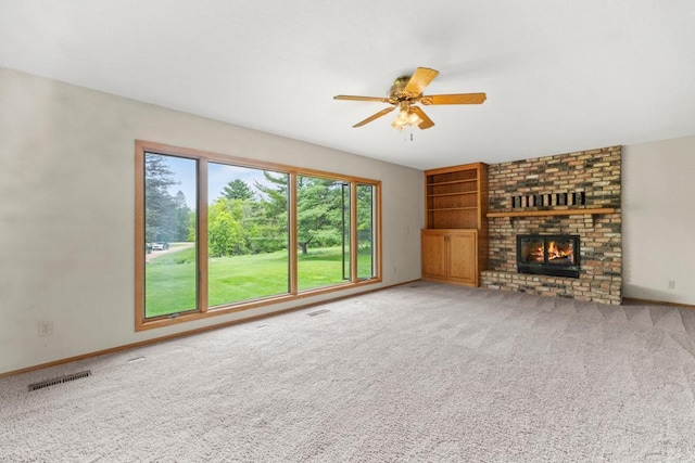2591 Carver Ave E, Maplewood, MN 55119 - unfurnished living room with a ceiling fan, a brick fireplace, carpet, and baseboards
