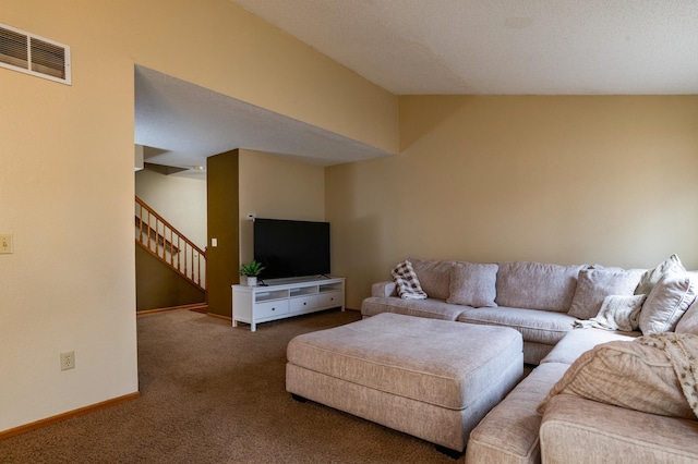 living area featuring stairway, carpet floors, visible vents, and baseboards